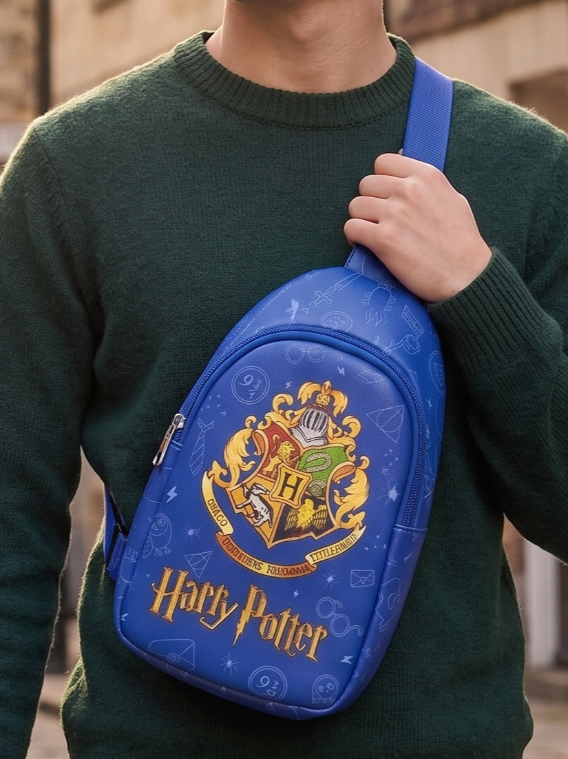 Harry Potter Hogwarts Sling Bag for Kids | Blue Crossbody Chest Bag with Hogwarts Crest Print, Adjustable Padded Strap & Spacious Compartment | School, Travel, Day Out & Gift Bag